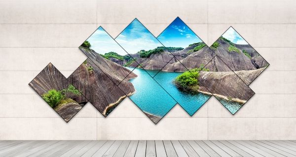 LG Digital Signage Video Wall welche einen See und Felsen anzeigt.